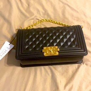 The Delta Black Quilted Chain Clutch